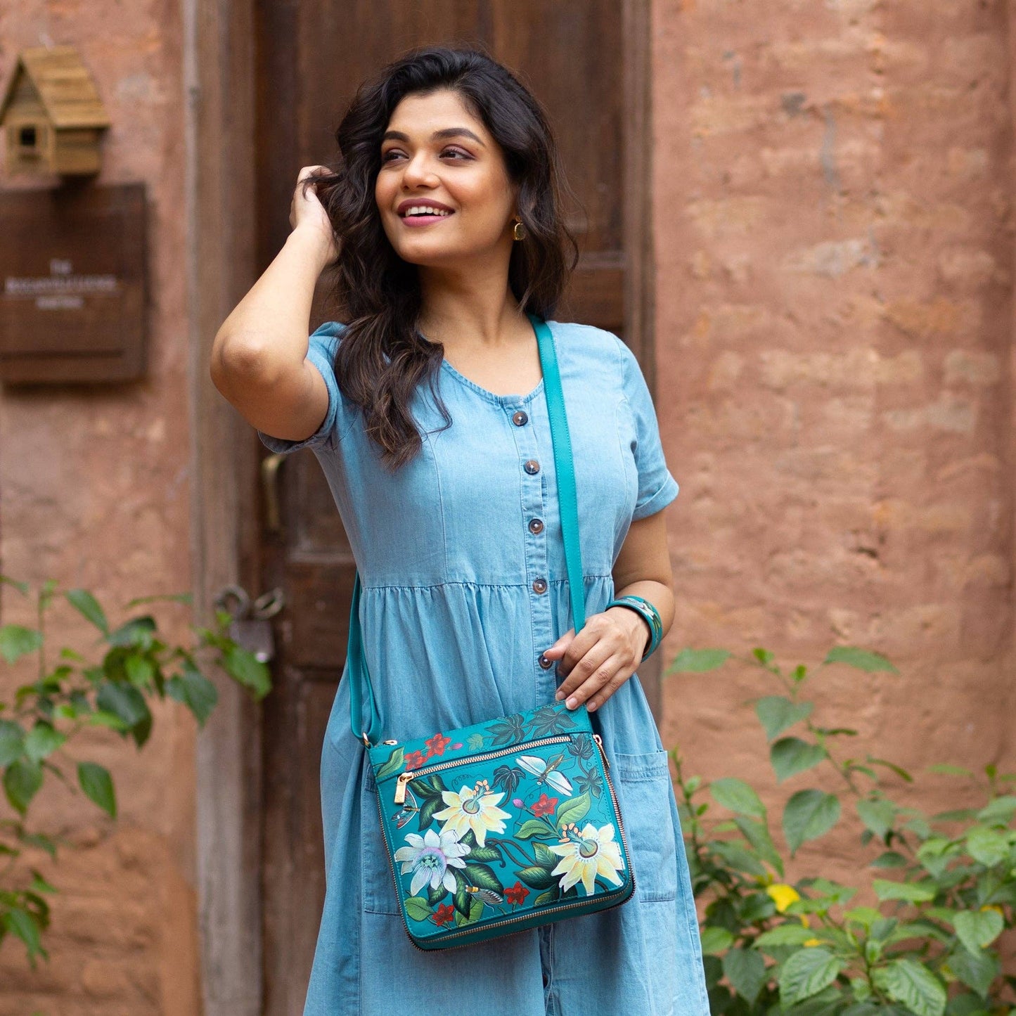 Anuschka Expandable Travel Crossbody - 550-blue with flowers and dragonfly